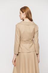 A beige double-breasted short jacket with a wide collar and a belt
