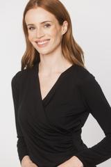 A black blouse with a deep wrap neckline and ruffles down the side