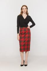 A black blouse with a deep wrap neckline and ruffles down the side