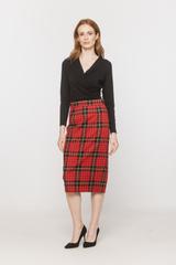 A black blouse with a deep wrap neckline and ruffles down the side