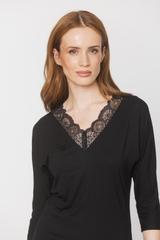 Black knit blouse with lace at the neckline