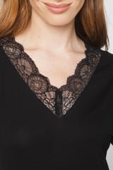 Black knit blouse with lace at the neckline