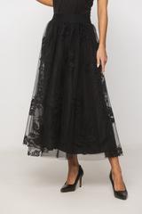 A black tulle skirt with a delicate floral pattern