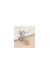 An elegant gold brooch in the shape of a bouquet featuring pearls and cubic zirconia