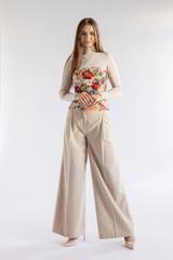 A jacquard corset made from a matt fabric with a floral pattern