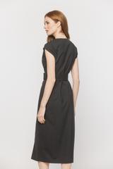 A graphite-coloured woollen dress that accentuates the shoulders and waist