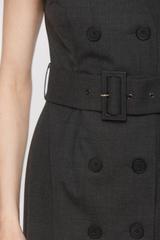 A graphite-coloured woollen dress that accentuates the shoulders and waist
