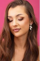 Elegant gold leaf-shaped earrings set with cubic zirconia