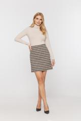 Short skirt made of thick fabric in the Chanel style