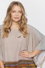 Luźna oryginalna tunika z troczkami w rękawach