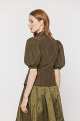 An olive-coloured taffeta shirt with puff sleeves and short sleeves