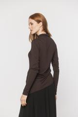 A brown jumper-style top with an asymmetrical cut