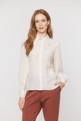 A light airy shirt made from textured cream-coloured viscose