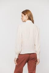 A light airy shirt made from textured cream-coloured viscose