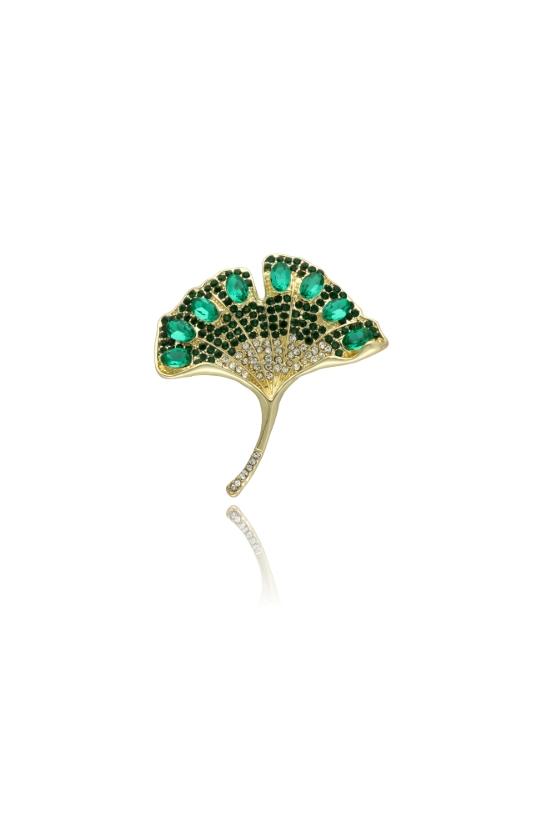 common:product-alt-prefix A gold brooch in the shape of a ginkgo leaf with green cubic zirconia stones