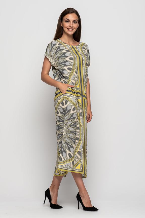 Long patterned dress with short sleeves and a zipper at the bottom