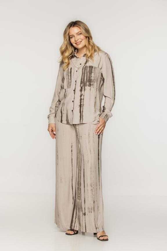 Beżowe printowane spodnie o luźnym kroju