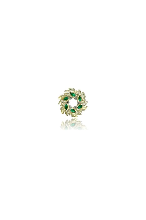 A stylish round gold brooch with green cubic zirconia stones