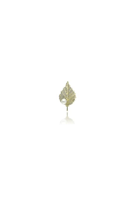 A gold leaf-shaped brooch with cubic zirconia and a pearl