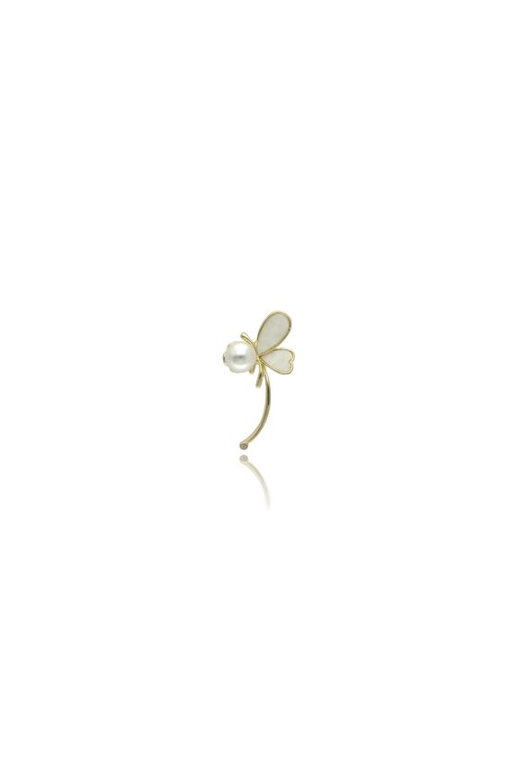 A gold butterfly brooch with mother-of-pearl and a large pearl