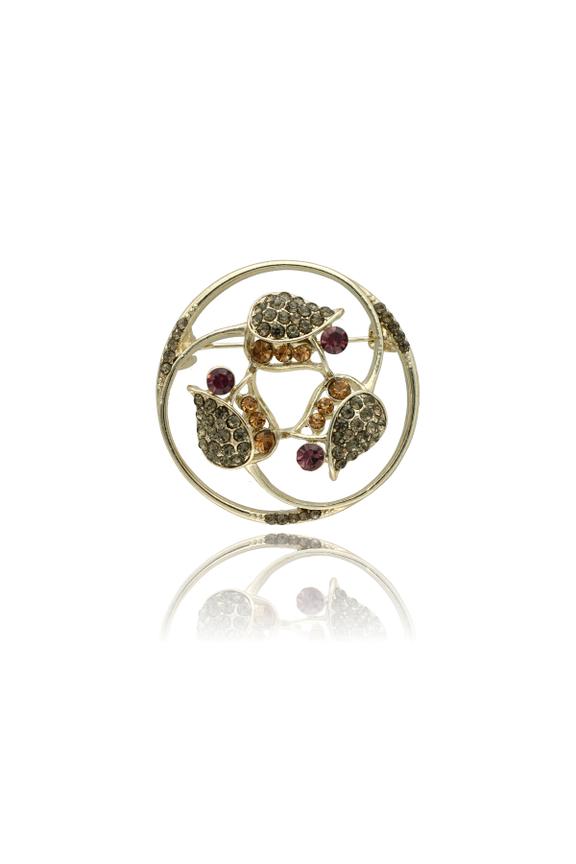 Złota broszka w stonowanych kolorach