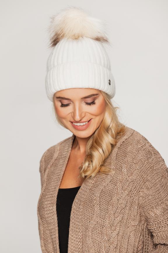 Cream cap with pom-pom