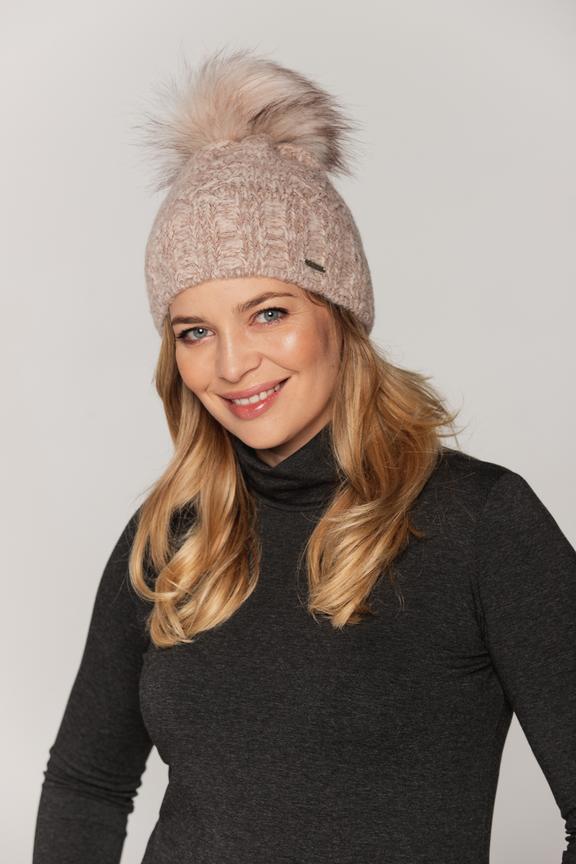 Fashionable women's cap with pom-pom